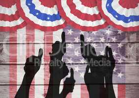 Thumbs up silhouettes against wooden american flack background