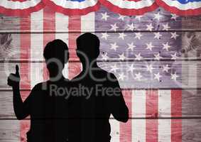 Thumbs Up silhouettes against american flag