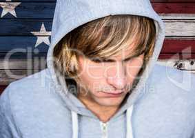 Close up of blond hair man in front of american flag