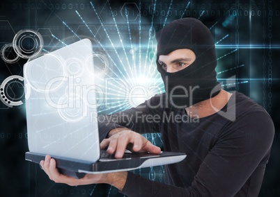 3d Hacker with hood using a laptop in front of digital background