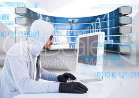 Hacker using a laptop in a data center