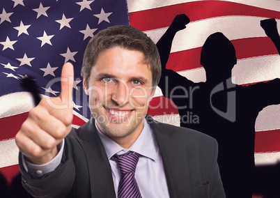 Business man with thumbs up against american flag