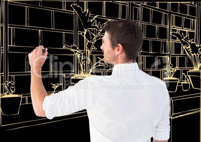 man drawing 3D office light lines in dark background