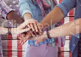 Smiling Friends with hands together against american flag