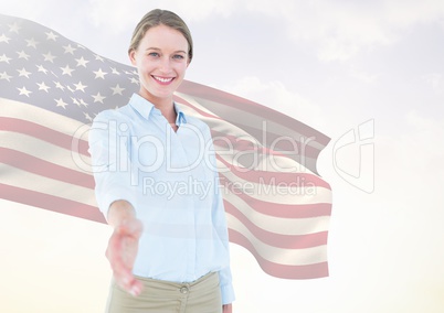 Business woman shaking her hand against american flag