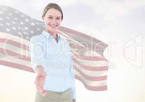 Business woman shaking her hand against american flag