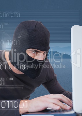 Close up of hacker working on laptop in front of blue background