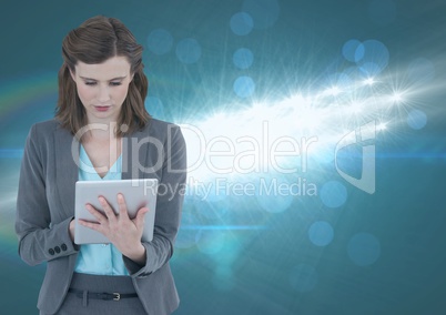 Pretty woman using a digital tablet in lights