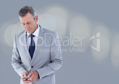 businessman texting in grey fog