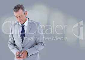 businessman texting in grey fog