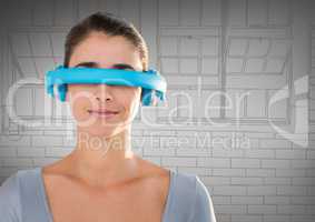 Woman in blue virtual reality headset against grey hand drawn windows