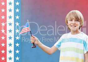 Smiling boy holding an american flag for independence day