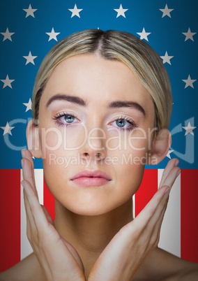 Pretty blond woman standing on an american flag background