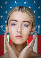 Pretty blond woman standing on an american flag background