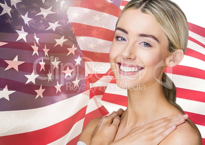 Smiling blond woman against american flag