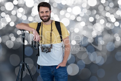 Smiling cameraman on a spotlight background