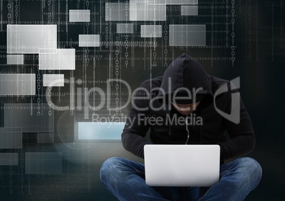 Hacker seated with cross-legged using a laptop in front of digital background