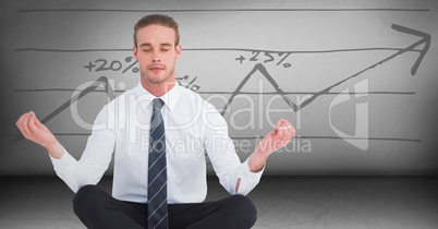 Business man meditating in grey room against graph