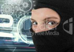 Woman hacker wearing an hood in front of digital background