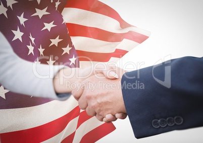 Business people shaking their hands against american flag