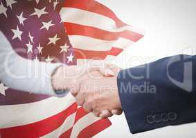 Business people shaking their hands against american flag