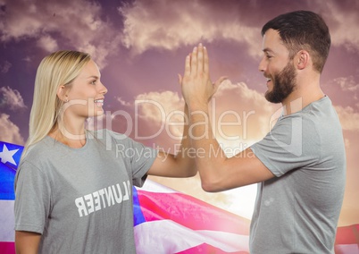 Couple high fiving against american flag