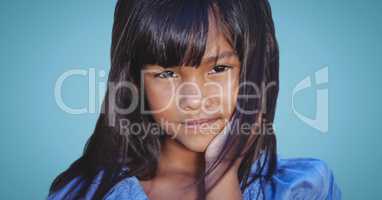 Close up of girl against blue background