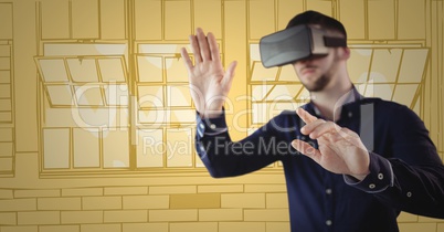 Man in virtual reality headset hands out against yellow hand drawn windows