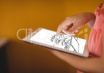hands with tablet with blueprint. In front of orange wall