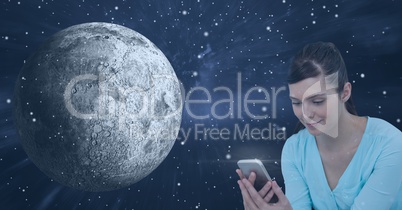 Smiling woman texting against universe background