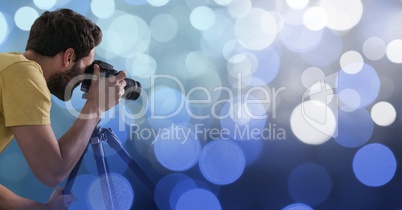 Photographer taking pictures against glowing background