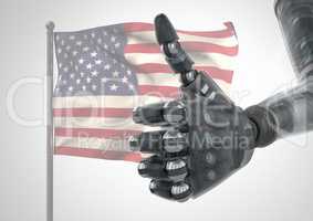 Robot with thumb up  against american flag