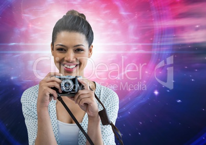 Photographer holding a camera against galaxy background