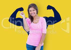 happy young woman in front of fists dark blue draw on yellow wall