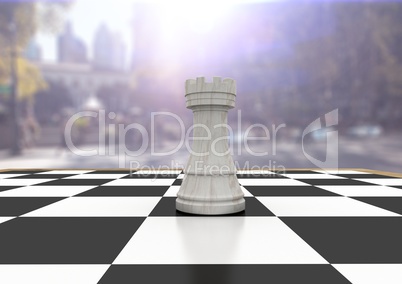 3D Chess pieces against blurry street with flares
