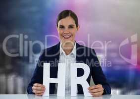 Business woman with HR letters against blurry purple wall