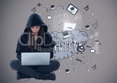 Woman hacker using a laptop in front of drawings