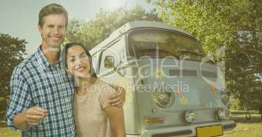 Couple Holding Keys with camper van in Summer