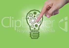 Hand pointing at cogs in 3d lightbulb graphic and flare against green background