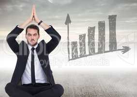 Business man meditating on concrete with grey graph doodle against foggy background