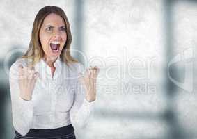 Angry business woman against blurry grey office with grunge overlay