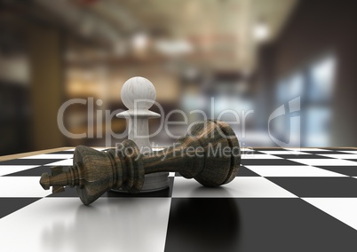 3D Chess pieces against blurry cafe