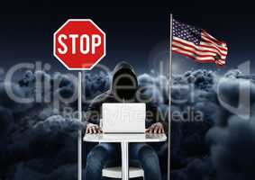 Hacker working on laptop near to 3D american flag and stop board with cloudy background