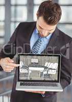 businessman showing the design of the new office on the computer