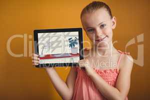 Smiling girl showing a colored drawing on her digital tablet
