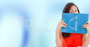 College student with blue book against blue abstract background