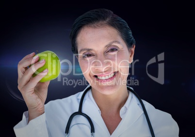 Female doctor with 3d apple against blue flare