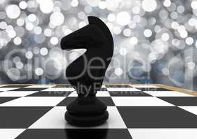 3d Chess piece against silver bokeh