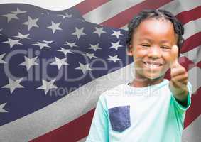 Children with thumb up against american flag