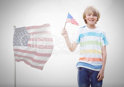 Child holding american flag in front of white background and american flag